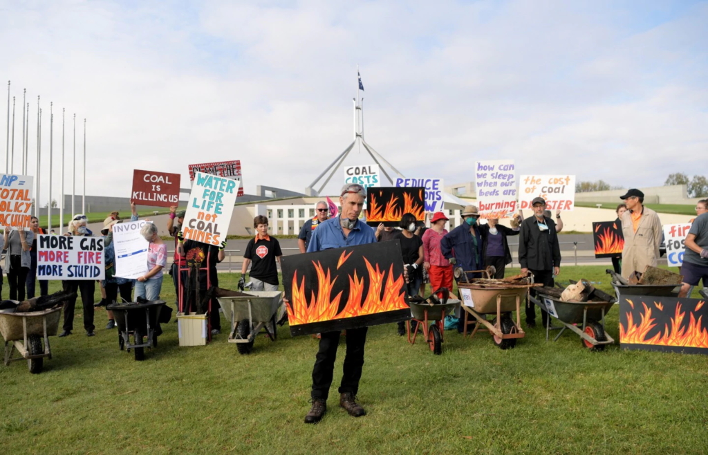 
Bushfire survivors with debris from burned houses protest the country’s climate policies at Australia’s Parliament House in Canberra on 11 February 2020. Photo: Tracey Nearmy / AFP / Getty Images