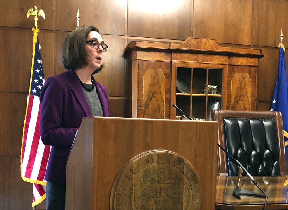 Gov. Kate Brown of Oregon denounces a walkout by Republicans in the state Senate that prevented a quorum on Monday, 24 February 2020 in Salem, Oregon. Republican lawmakers are trying to doom a contentious climate change bill. Brown said the Republicans are not against the climate policy but are against the Democratic process. Photo: Andrew Selsky / AP Photo