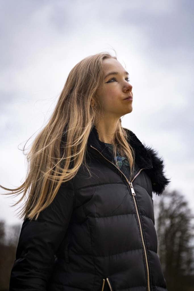 Naomi Seibt poses for a portrait near her home in Munster, Germany. Seibt, 19, uses YouTube to denounce “climate alarmism,” countering the arguments of young climate activist Greta Thunberg. Seibt uses her media platform to spread long-debunked arguments used by people who deny climate science. Photo: Sebastien Van Malleghem / The Washington Post