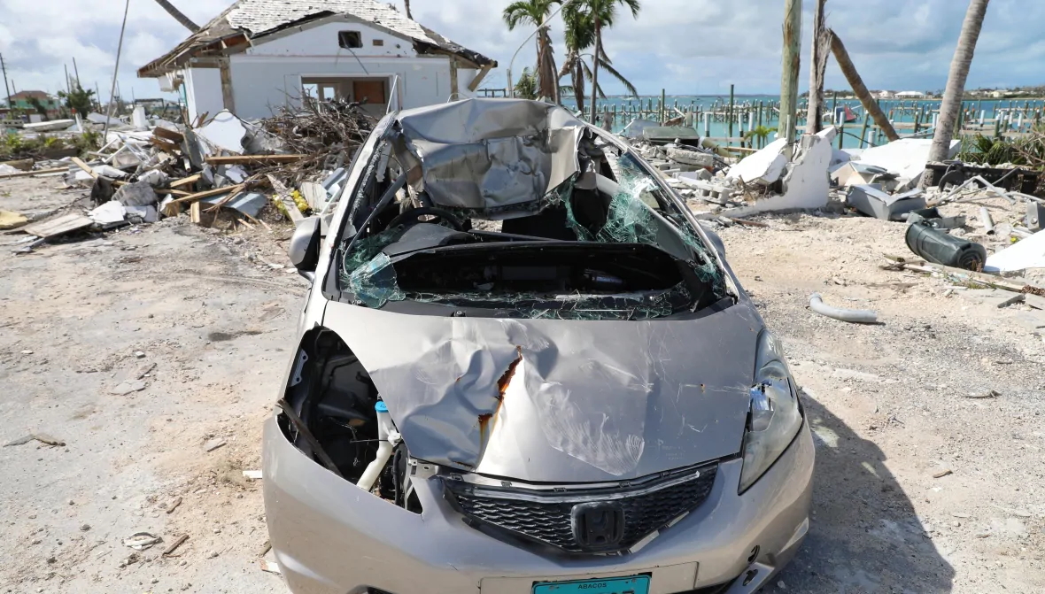 A car and home damaged by Hurricane Dorian show the extent of the damage to the island of Great Abaco even six months after the storm in February 2020. Photo: David Common / CBC