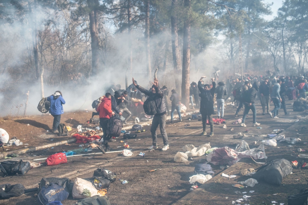 Dozens of Greek security officers and soldiers fired tear gas as riot police officers with batons, shields and masks confronted migrants, yelling at them to stay back on Saturday, 29 February 2020. Photo: Bulent Kilic / Agence France-Presse / Getty Images