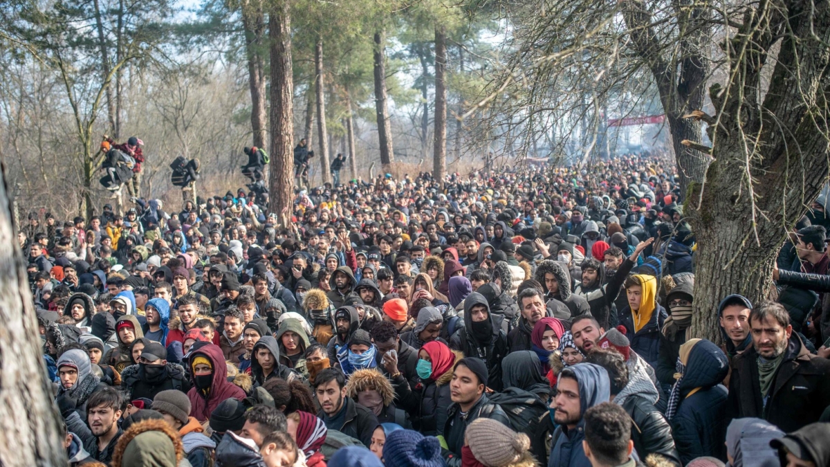 In Kastanies, Greece, with tear gas clouding the air, thousands of migrants trying to reach Europe clashed with riot police officers on the Greek border with Turkey on Saturday morning, 29 February 2020, signaling a new and potentially volatile phase in the migration crisis. About 4,000 migrants of various nationalities were pressed against the Turkish side of the border and an additional 500 or so people were trapped between two border posts, but still on the Turkish side. Photo: Bulent Kilic / Agence France-Presse / Getty Images