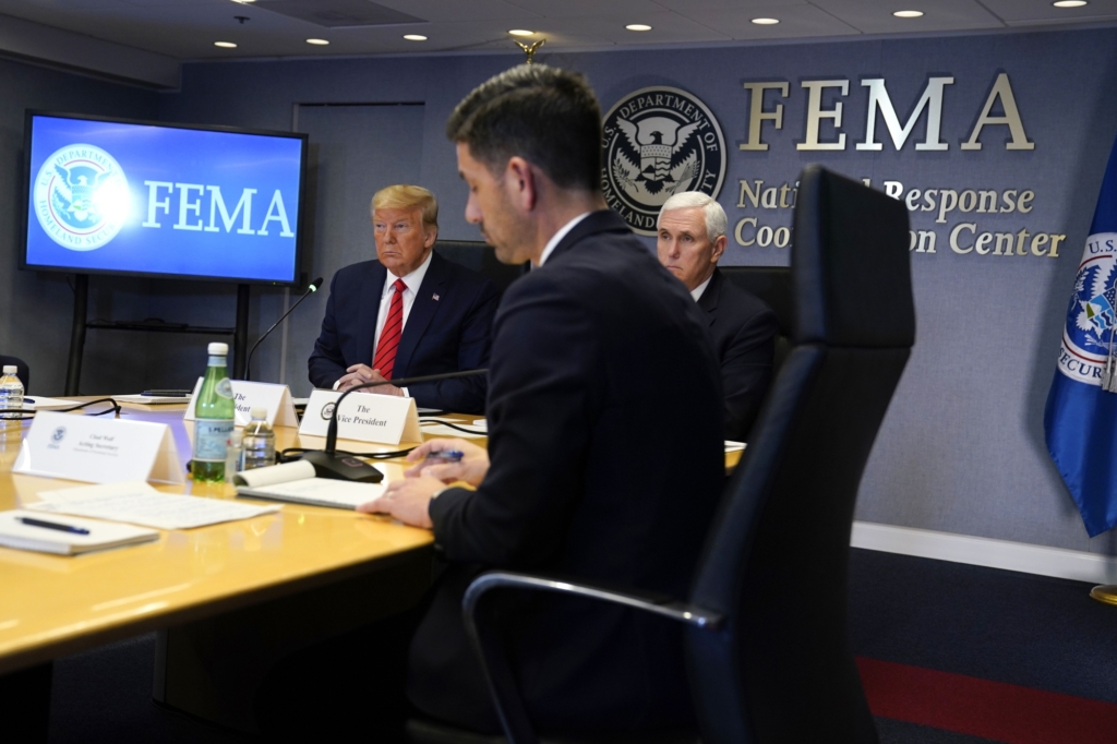 Trump (left) and Vice President Mike Pence (right) at a FEMA meeting on Thursday, 19 March 2020. Photo: Evan Vucci / AP Photo