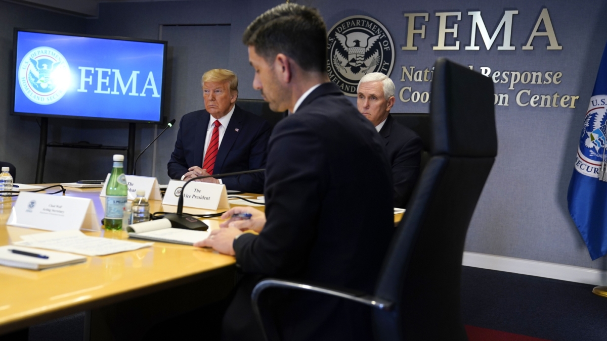 Trump (left) and Vice President Mike Pence (right) at a FEMA meeting on Thursday, 19 March 2020. Photo: Evan Vucci / AP Photo