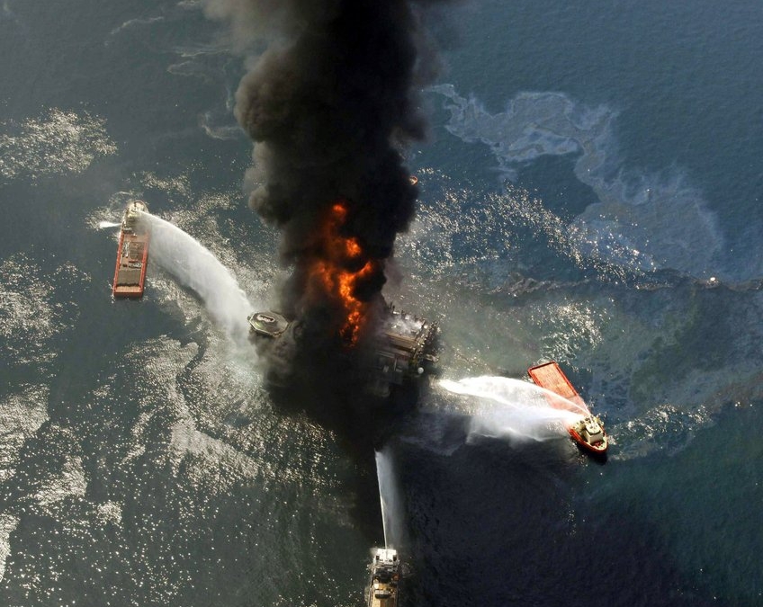 Aerial view of the Deepwater Horizon oil rig burning after an explosion in the Gulf of Mexico, off the southeast tip of Louisiana, 21 April 2010. Ten years after an oil rig explosion killed 11 workers and unleashed an environmental nightmare in the Gulf of Mexico, companies are drilling into deeper and deeper waters where the payoffs can be huge but the risks are greater than ever. Photo: Gerald Herbert / AP Photo