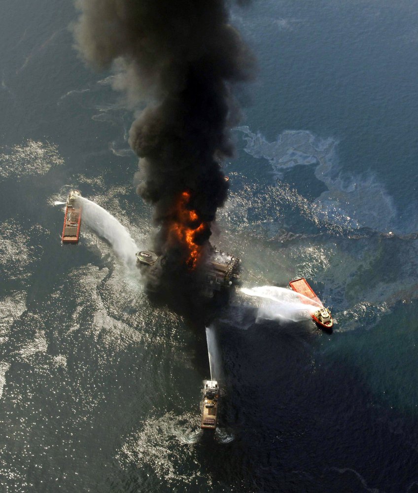 Aerial view of the Deepwater Horizon oil rig burning after an explosion in the Gulf of Mexico, off the southeast tip of Louisiana, 21 April 2010. Ten years after an oil rig explosion killed 11 workers and unleashed an environmental nightmare in the Gulf of Mexico, companies are drilling into deeper and deeper waters where the payoffs can be huge but the risks are greater than ever. Photo: Gerald Herbert / AP Photo