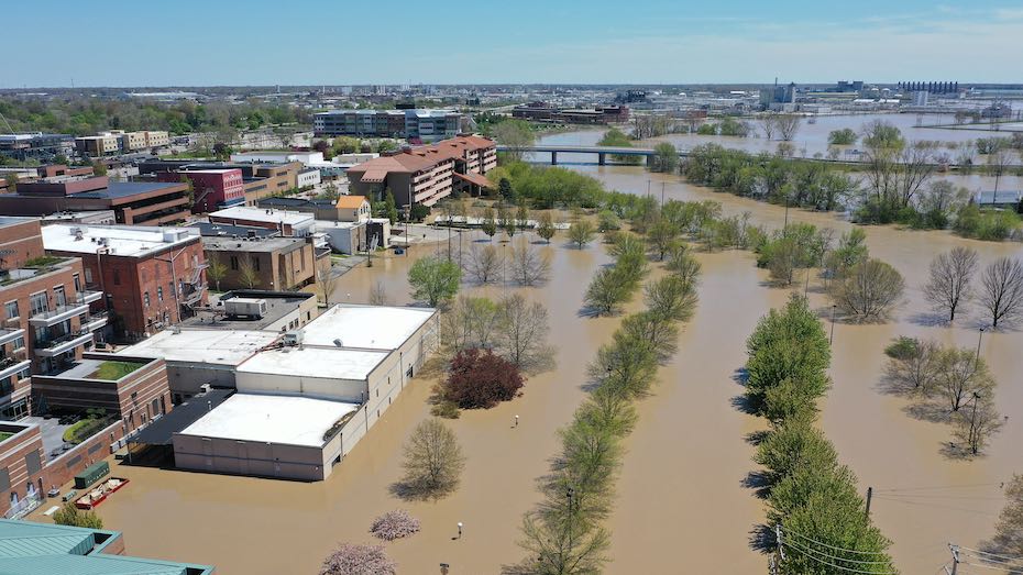 An aerial view of floodwaters flowing from the Tittabawassee River into the lower part of downtown Midland on 20 May 2020 in Midland, Michigan. Thousands of residents have been ordered to evacuate after two dams in Sanford and Edenville collapsed causing water from the Tittabawassee River to flood nearby communities. Photo: Gregory Shamus / Getty Images