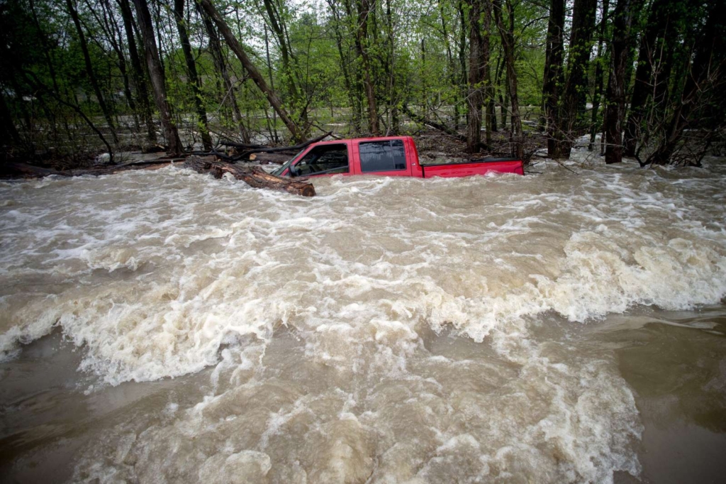 Tittabawassee Fire and Rescue rescued the driver from this red pickup truck on Norh Gleaner Road near its intersection with Tittabawassee Road on Tuesday, 19 May 2020 in Saginaw County, Michigan. Photo: Jake May