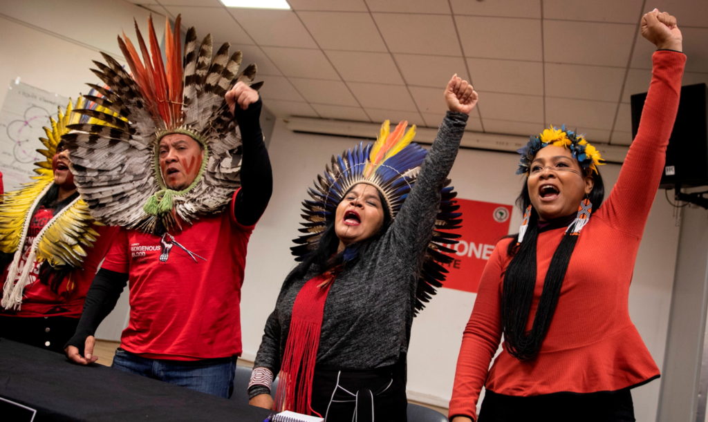 Brazilian Indigenous leader Sonia Guajajara (centre) of the Guajajara tribe and head of the Articulação dos Povos Indígenas do Brasil (Brazil’s Indigenous  People Articulation), calling on EU lawmakers to exert pressure on the Brazilian government to better protect the rights of indigenous communities, 12 November 2019. Photo: Thomas Samson / AFP / Getty Images