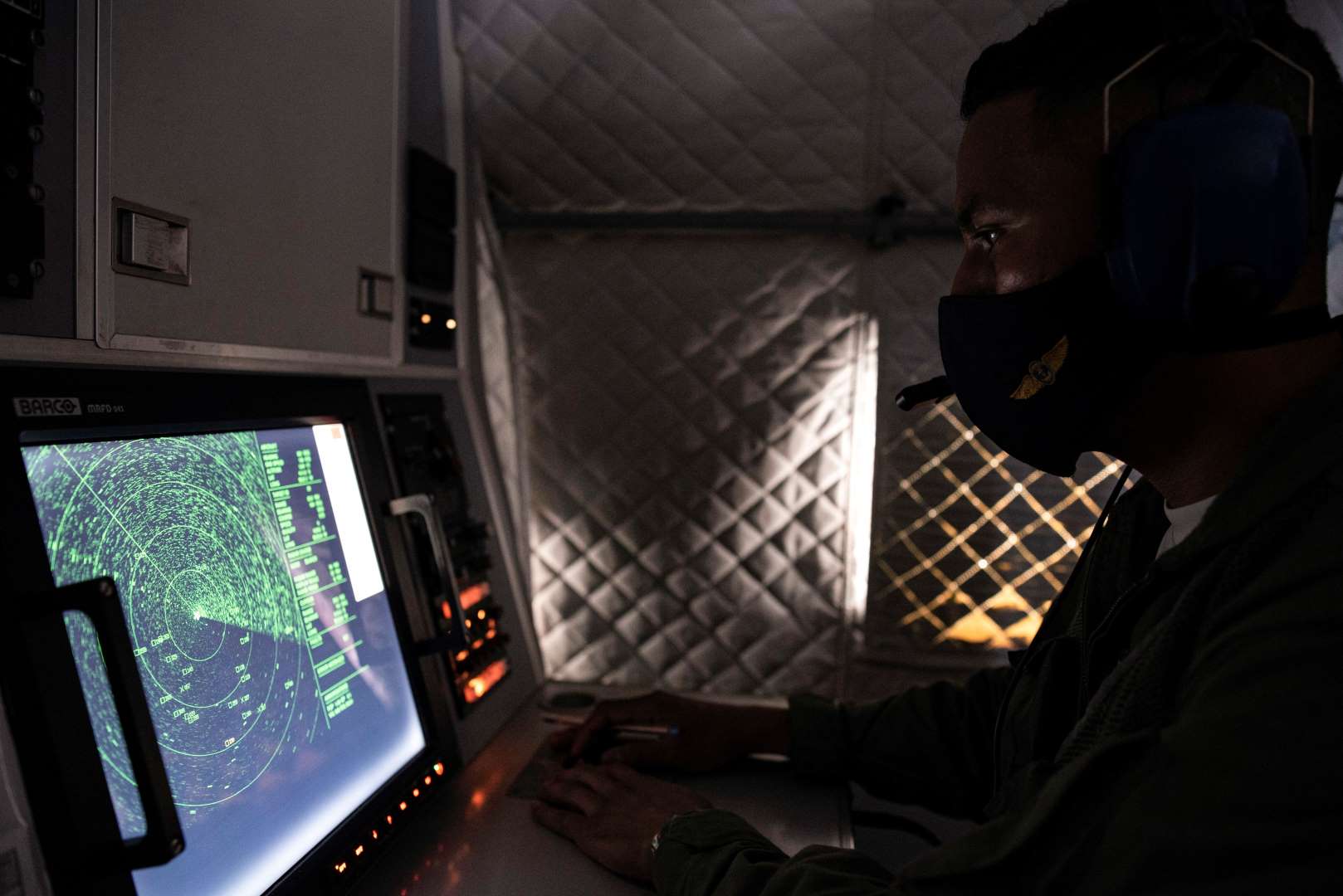 An Ecuadorian navy officer looks at a radar after a fishing fleet of mostly Chinese-flagged ships was detected in an international corridor that borders the Galapagos Islands' exclusive economic zone, in the Pacific Ocean, on 7 August 2020. Photo: Santiago Arcos / Reuters