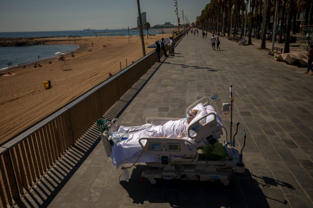 Francisco Espana looks at the Mediterranean sea from a promenade next to the Hospital del Mar in Barcelona, Spain, on 4 September 2020. After 52 days in the hospital’s intensive care unit due to the coronavirus, Francisco was allowed by his doctors to spend almost ten minutes at the seaside as part of his recovery therapy. Photo: Emilio Morenatti / AP Photo