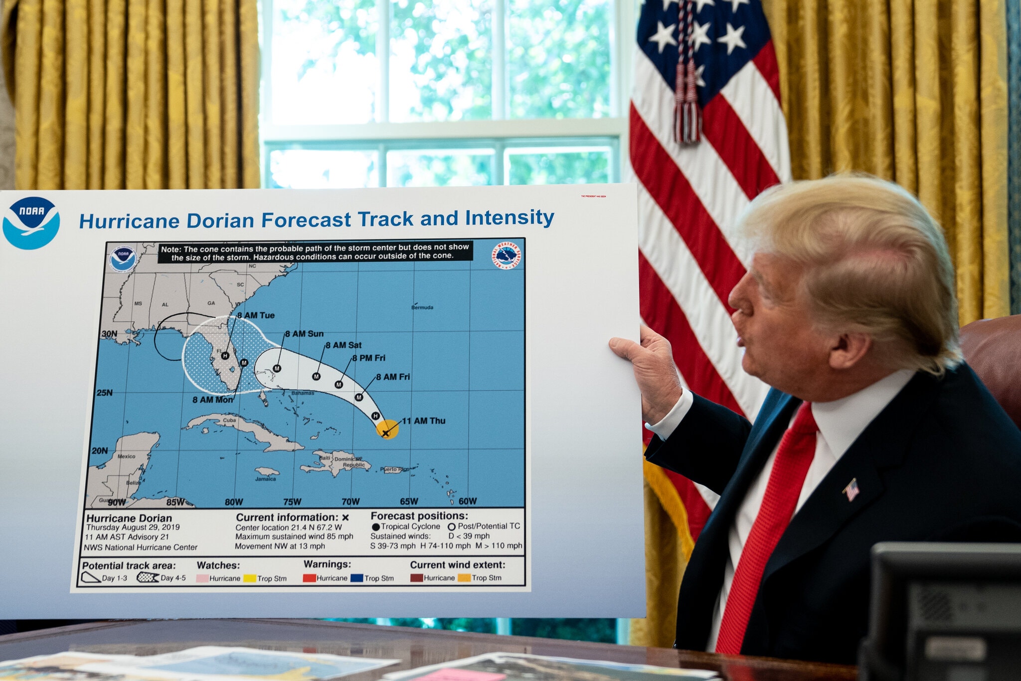 Trump refers to a map, modified using a Sharpie, while talking to reporters following a briefing from officials about Hurricane Dorian in the Oval Office at the White House on 4 September 2019. Trump has dismissed scientific evidence and fact numerous times, including 2019 when he displayed a map inaccurately modified to show Hurricane Dorian’s likely path. Photo: Erin Schaff / The New York Times