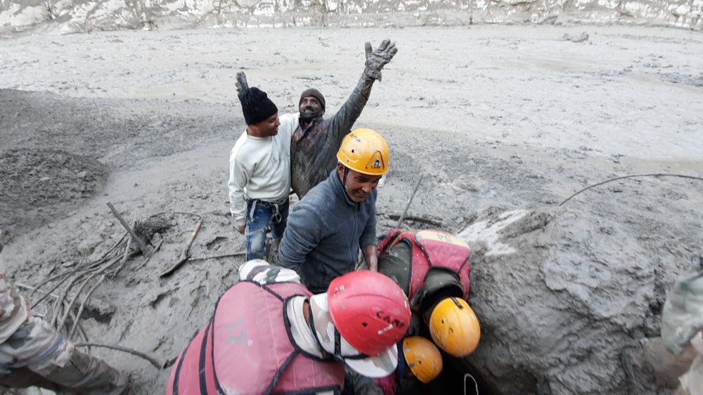 A man reacts after he was pulled out from beneath the ground by Indo Tibetan Border Police (ITBP) personnel during rescue operations after a portion of the Nanda Devi glacier broke off in the Tapovan area of the northern state of Uttarakhand, India, Sunday, 7 February 2021. Photo: Indo Tibetan Border Police / AP