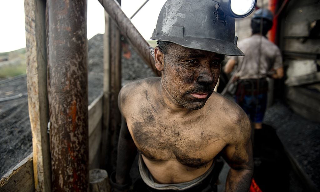 A Mexican miner emerges from a shaft in a coal mine in Agujita, Coahuila state, on 13 November 2012. Photo: Yuri Cortéz / AFP / Getty Images