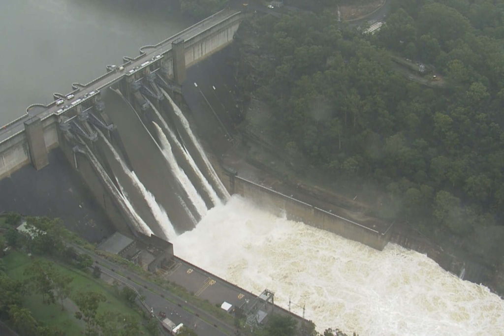 Floodwater spills over the Warragamba Dam in the Sydney suburb of Warragamba in New South Wales, Australia on 21 March 2021. Since the heavy rain hit on 20 March 2021, Warragamba’s spillway released 450 gigalitres a day. Sydney Harbour holds about 500 gigalitres. Photo: NINE NEWS