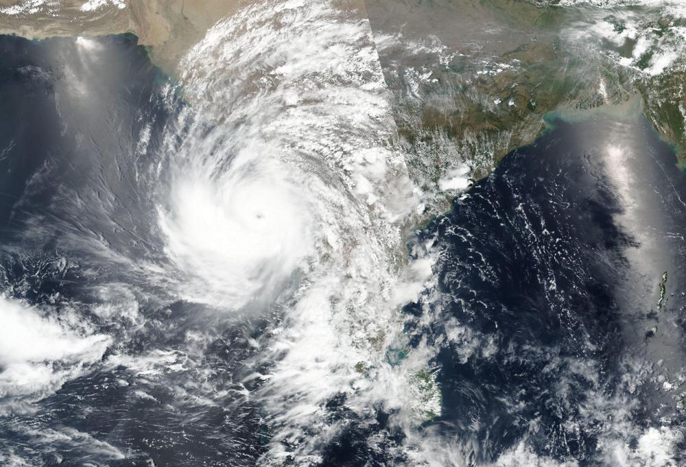 Satellite view of Cyclone Tauktae approaching western India, 16 May 2021. Tauktae is roaring in the Arabian Sea off southwestern India with winds of up to 140 kph (87 mph), already causing heavy rains and flooding that have killed multiple people, officials said Sunday. Cyclone Tauktae, the season’s first major storm, is expected to make landfall early Tuesday in Gujarat state, a statement by the India Meteorological Department said. Photo: NASA Worldview / Earth Observing System Data and Information System (EOSDIS) / AP
