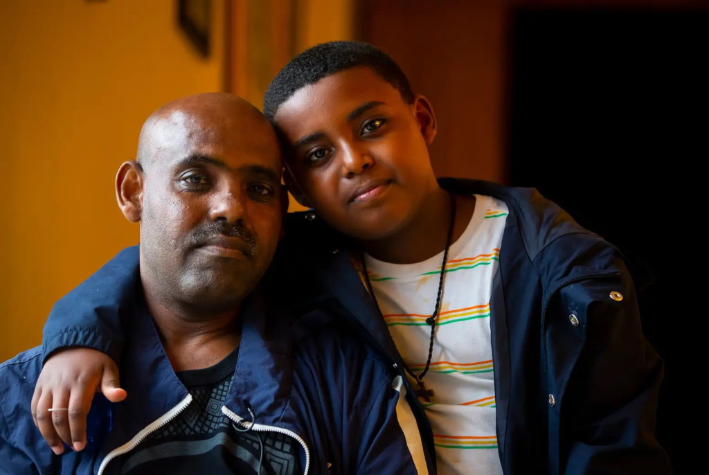 Shalemu Bekele and his son, Beimnet, in April 2021. The family suffered from carbon monoxide poisoning in Texas during Winter Storm Uri. Photo: Annie Mulligan / ProPublica / The Texas Tribune / NBC News