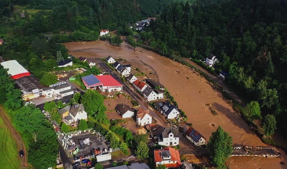 Aerial view of the devastation caused by the flooding of the Ahr River in the Eifel village of Schuld, western Germany, on 15 July 2021. At least 42 people died after record rainfall caused heavy flooding and turned streams and streets into raging torrents, sweeping away cars and causing some buildings to collapse. Photo: Christoph Reichwein / dpa / AP