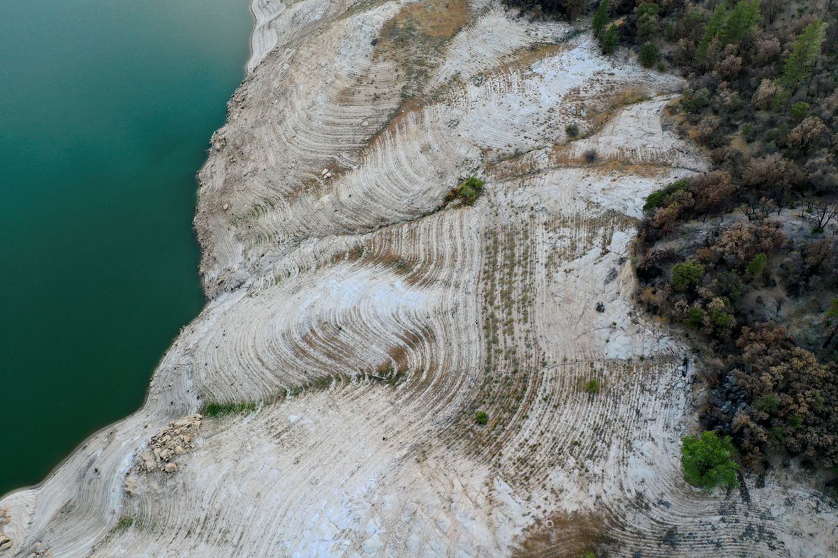 An aerial view shows low water levels at Lake Oroville, which is the second largest reservoir in California and according to daily reports of the state's Department of Water Resources has declined to near 35 percent capacity due to record drought and heat, near Oroville, California, 16 June 2021. Photo: Aude Guerrucci / REUTERS