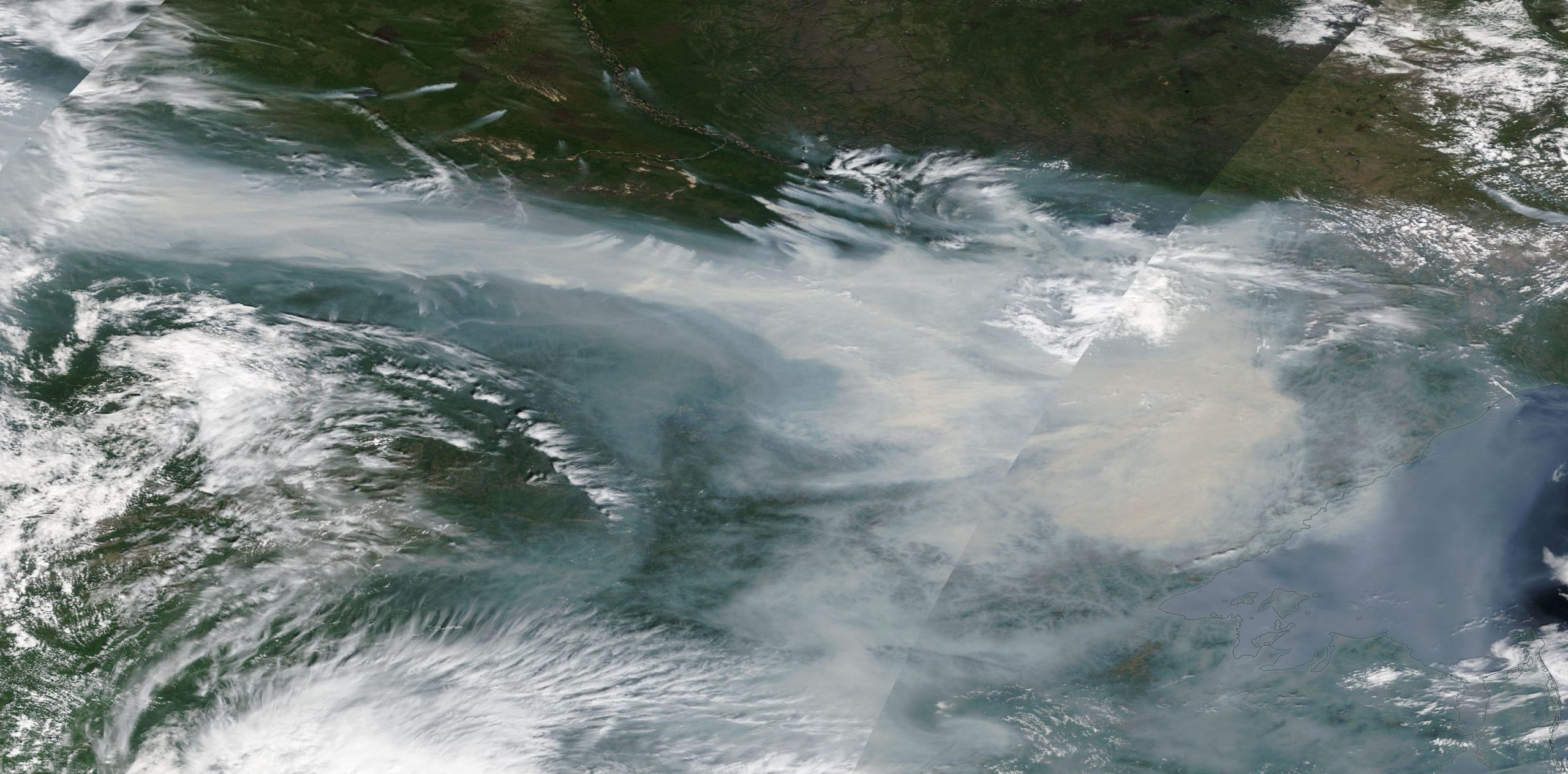 Satellite view of smoke from wildfires in the Yakutia region of Siberia, 18 July 2021. Photo: NASA / EOSDIS