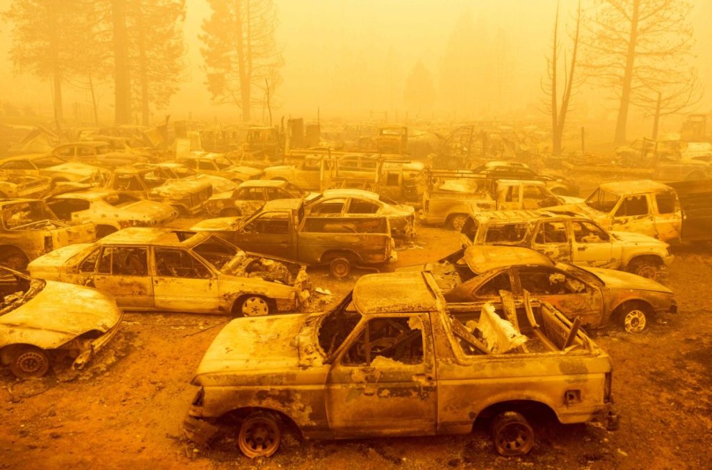 Dozens of burned vehicles rest in heavy smoke during the Dixie fire in Greenville, California. on 6 August 2021. Photo: Josh Edelson / AFP / Getty Images