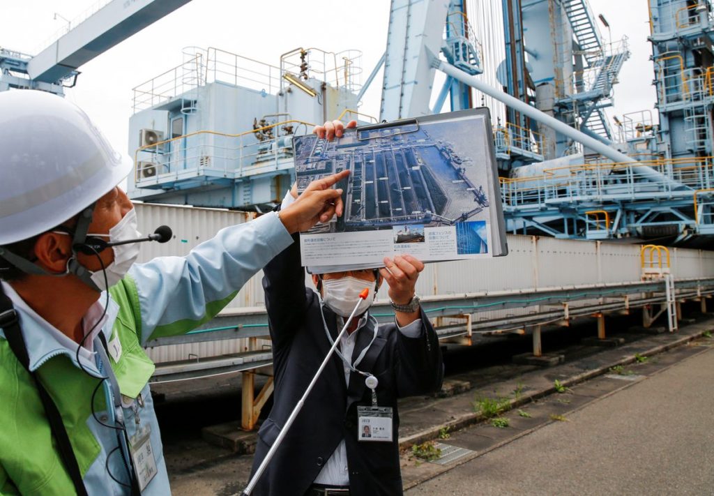 Employees of JERA speak to reporters at JERA’s Hekinan thermal coal power station in Hekinan, central Japan, 18 October 2021. Photo: Yuka Obayashi / REUTERS