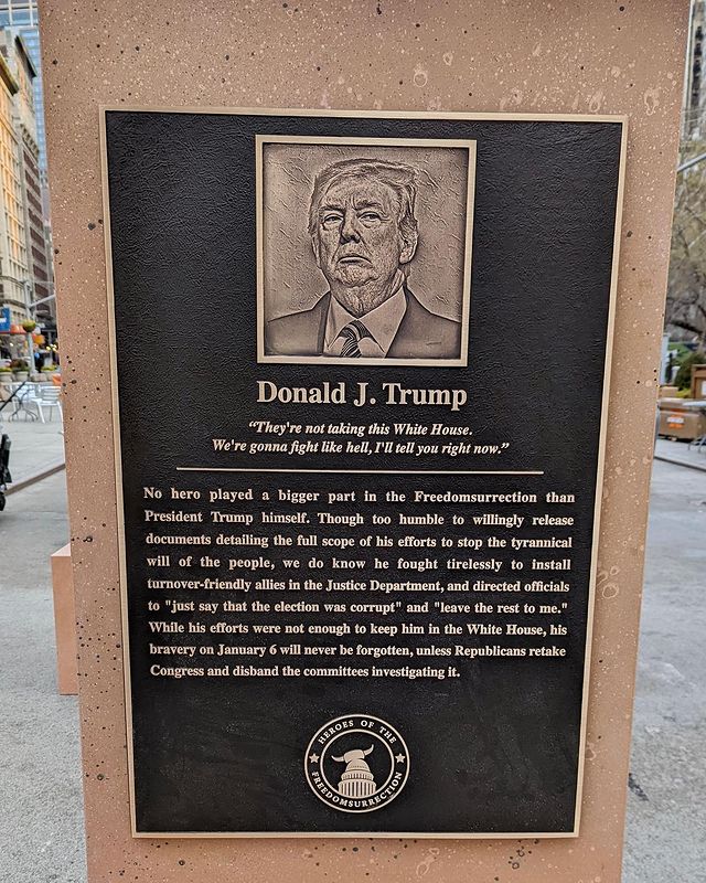 A plaque depicts Donald Trump as a “Hero of the Freedomsurrection”, part of an art installation in New York City’s Flatiron Plaza on 6 January 2022. The plaques were created by Trevor Noah and “The Daily Show” to commemorate the first anniversary of Trump's coup attempt and his co-conspirators in the insurrection. Trump’s plaque reads, “No hero played a bigger part in the Freedomsurrection than President Trump himself. Though too humble to willingly release documents detailing the full scope of his efforts to stop the tyrannical will of the people, we do know he fought tirelessly to install turnover-friendly allies in the Justice Department and directed officials to ‘just say the election was corrupt’ and ‘leave the rest to me.’ While his efforts were not enough to keep him in the White House, his bravery on January 6 will never be forgotten, unless Republicans retake Congress and disband the committees investigating it.” Photo: The Daily Show