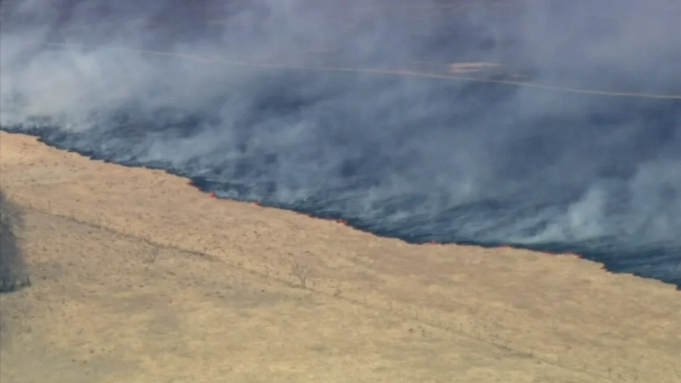 Aerial view of a wildfire burning in a large swath of land west of Fort Worth, Texas on Friday, 18 March 2022, in what fire officials call the Eastland Complex. Photo: NBC 5 News