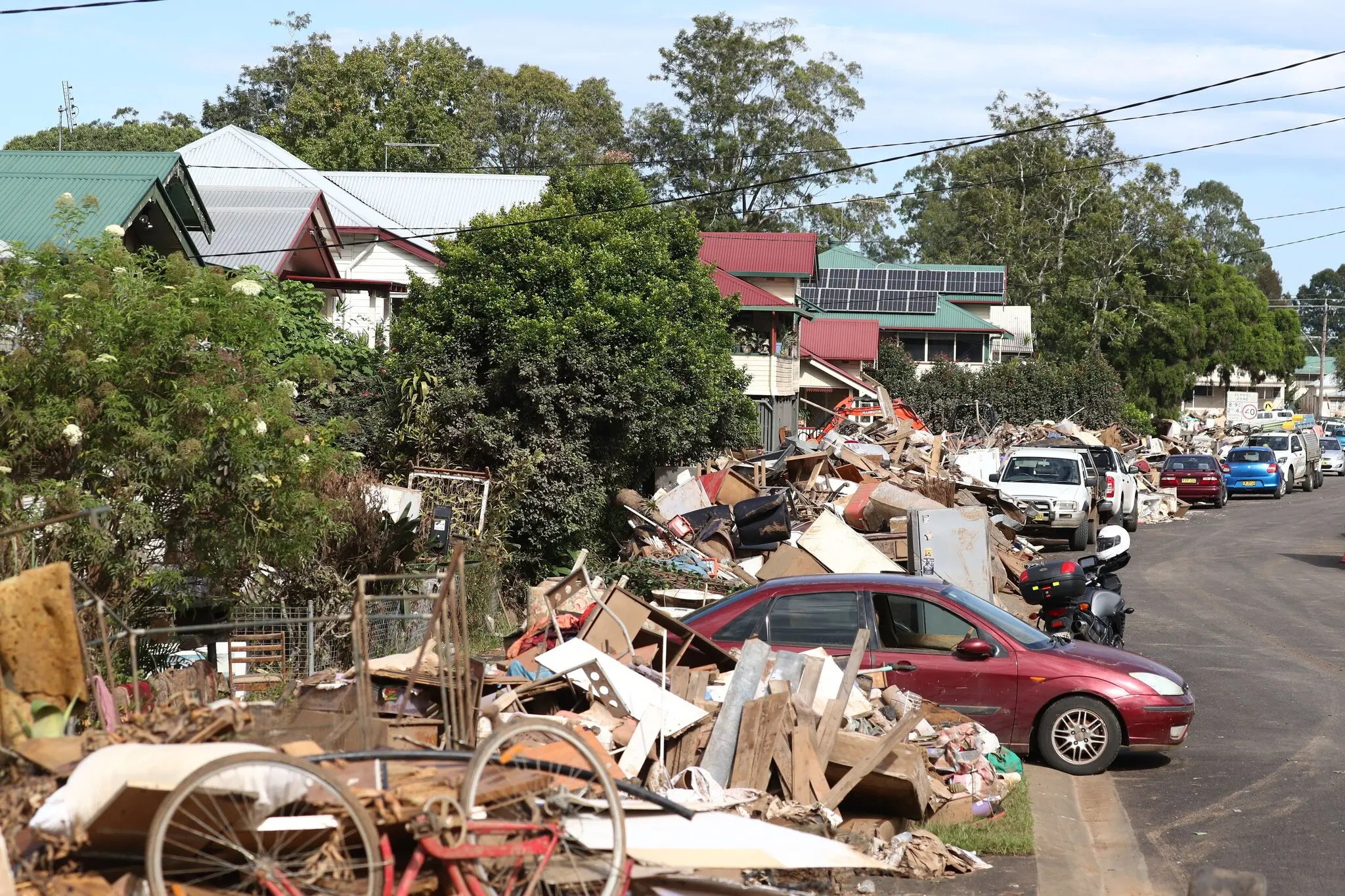 Flood debris lines a street in South Lismore, New South Wales, Australia on 9 March 2022. Photo: Jason O'Brien / EPA / Shutterstock