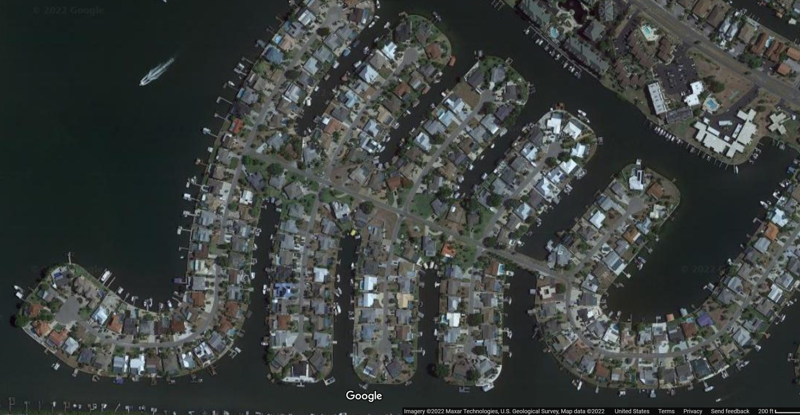 Satellite view of Apollo Beach, Florida in 2022. The community is a maze of canals lined with hundreds of houses perched on the water’s edge. The whole community, just south of Tampa, is only three feet above sea level, meaning it’s at risk from storm surge as sea levels rise. Photo: Google / Maxar