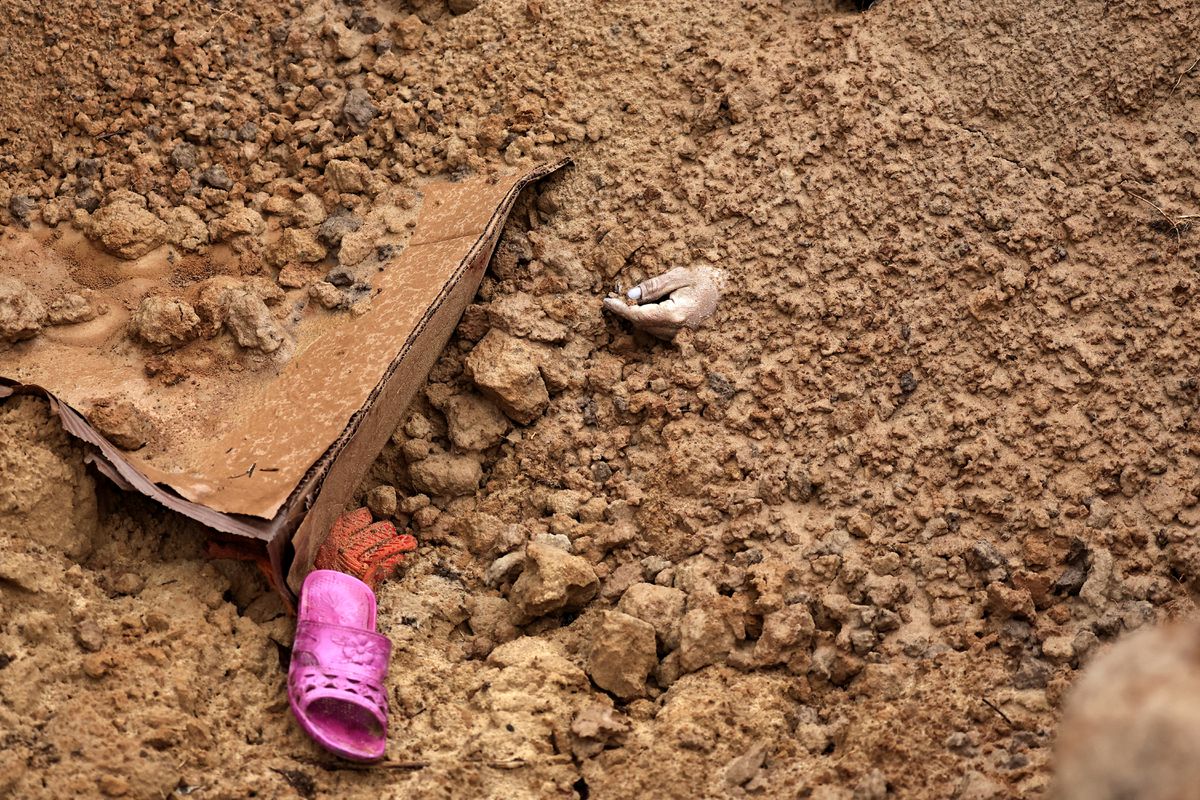 A body of a civilian, who according to residents was executed by Russian army soldiers and then buried along with others in one grave, is seen amid Russia's invasion of Ukraine, in Bucha, in the region of Kyiv, Ukraine 2 April 2022. Photo: Zohra Bensemra / REUTERS