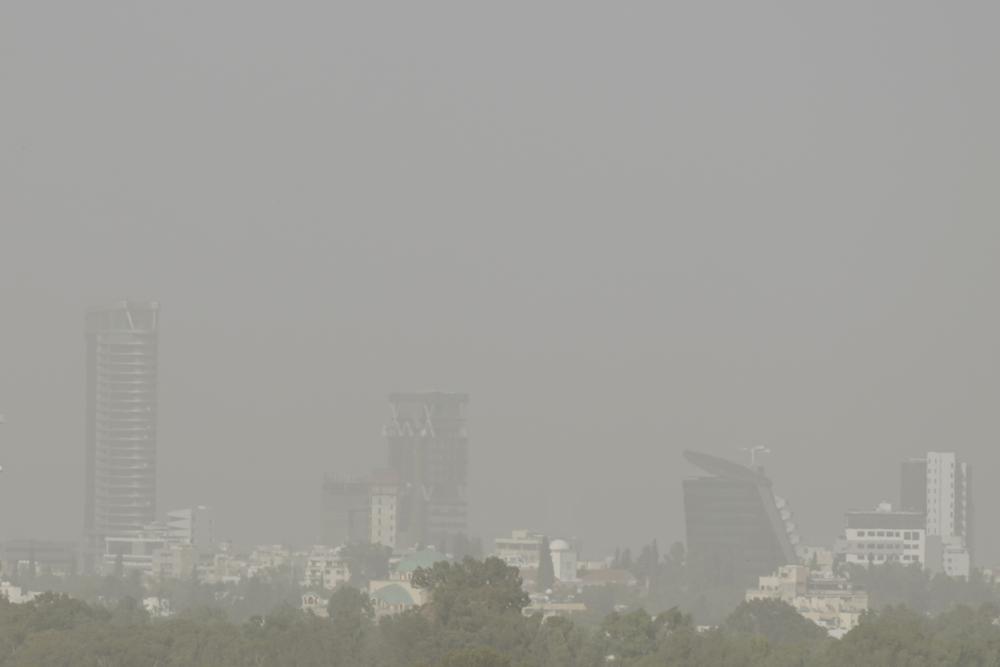 A haze caused by dust covers the capital Nicosia, in the southeast Mediterranean island of Cyprus, on Monday, 4 April 2022. The World Health Organization (WHO), the U.N. health agency, says nearly everybody in the world breathes air that doesn't meet its standards for air quality. WHO is calling for more action reduce fossil-use use that generate pollutants that cause respiratory and blood-flow problems and lead to millions of preventable deaths each year. Photo: Petros Karadjias / AP Photo