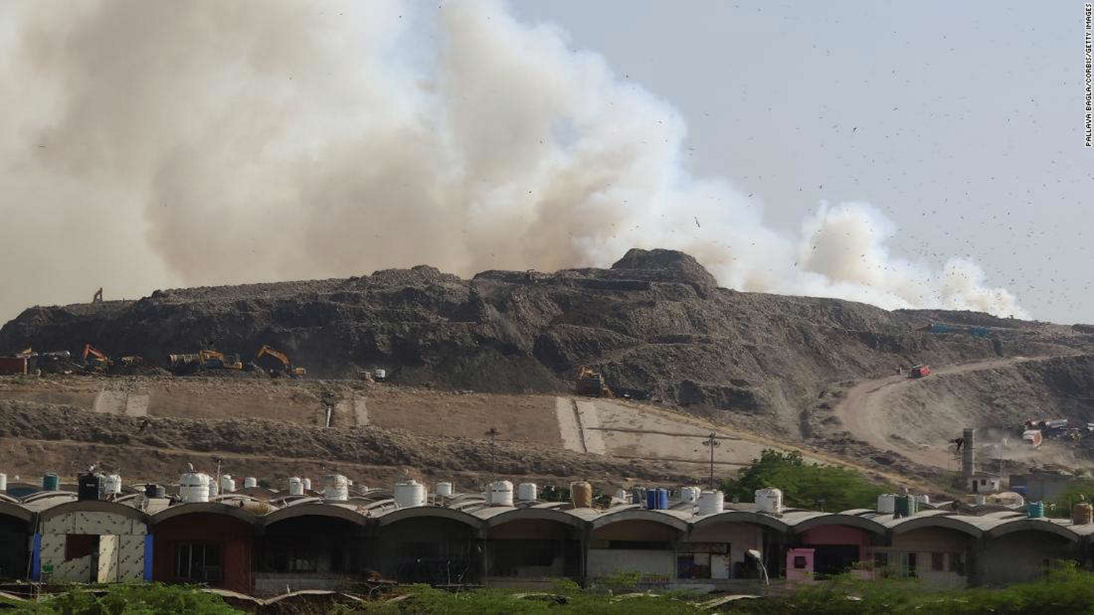 Smoke rises from a blaze at the Ghazipur landfill in New Delhi, India, on 28 March 2022. Photo: Pallava Bagla / Corbis / Getty Images