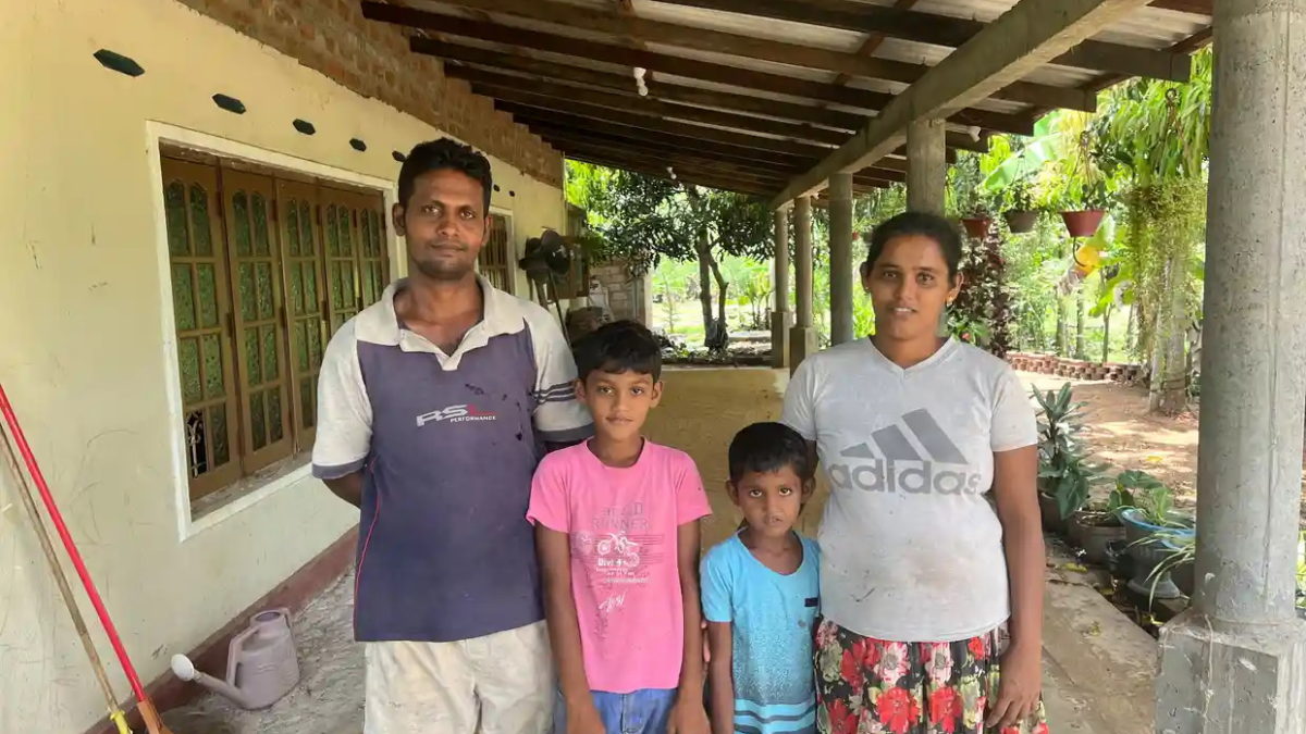 Sri Lanka rice farmer Niluka Dilrukshi with his wife, Milinda, and their two children. They saw their rice crop deplete by 60 percent in the last harvest due to the government chemical pesticide ban. Photo: Hannah Ellis-Petersen / The Guardian
