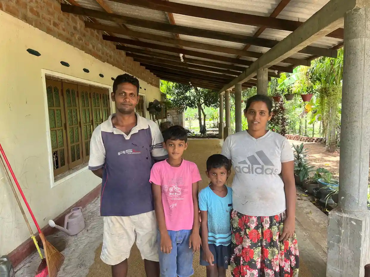 Sri Lanka rice farmer Niluka Dilrukshi with his wife, Milinda, and their two children. They saw their rice crop deplete by 60 percent in the last harvest due to the government chemical pesticide ban. Photo: Hannah Ellis-Petersen / The Guardian