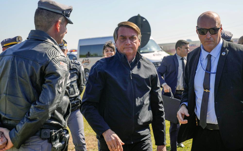 Brazilian President Jair Bolsonaro arrives at a resort hotel to meet with Elon Musk in Porto Feliz, Brazil, Friday, 20 May 2022. The Telsa and SpaceX chief executive officer tweeted that he was in Brazil to help bring Internet service to rural schools in the Amazon and to help monitor the Amazon environmentally. Photo: Andre Penner / AP Photo