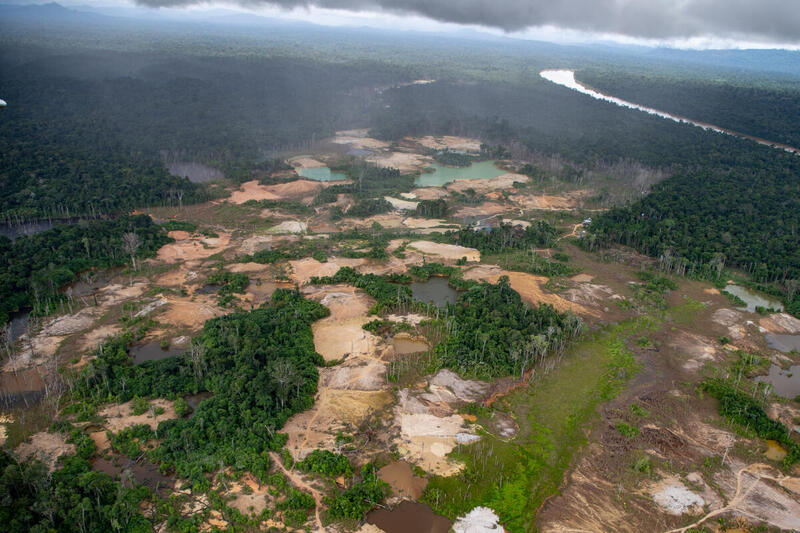 Aerial view of an illegal mining operation on Yanomami land in Roraima, in the Amazon rainforest. By April 2021, a Greenpeace flyover had already shown the expansion of the mine in the Yanomami land, which a year later was the second most deforested indigenous territory in the entire Amazon. Photo: Christian Braga / Greenpeace