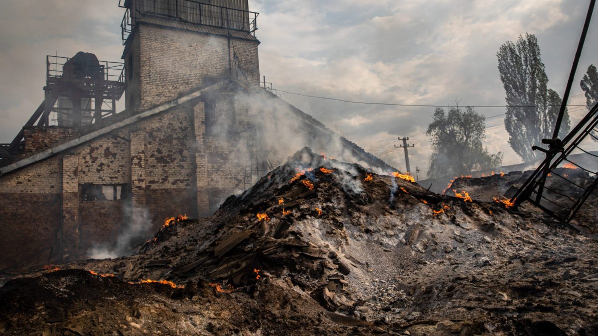 The ashes of burnt grain can be seen in a grain silo in the town of Sivers’k, Donbas in May 2022. Photo: Alex Chan / SOPA Images / Sipa USA / Reuters