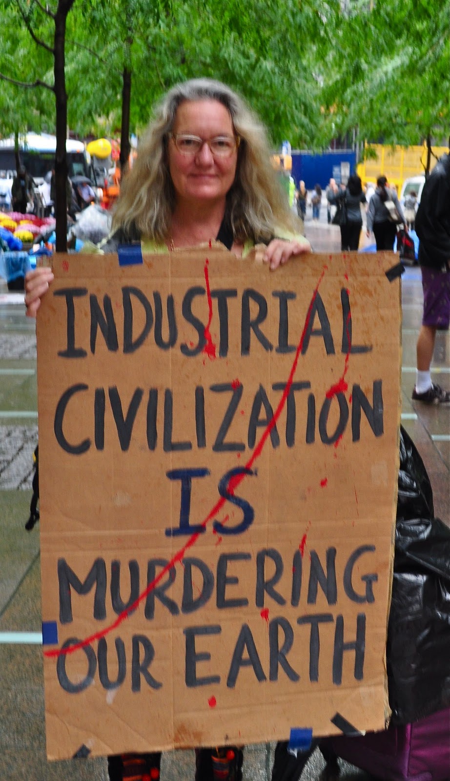 Gail Zawacki at the Occupy Wall Street protest in New York City, 23 September 2011. She carries a sign that reads, “Industrial civilization is murdering our Earth”. Photo: Gail Zawacki