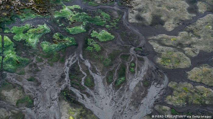 Aerial view of the dried-up riverbed at the confluence of the Ticino and Po rivers at Ponte della Becca, near Linarolo, Italy. Never since weather records began 70 years ago has the water level of the Po been lower. Scientists have been warning of increasing drought in northern Italy for many years. Photo: Piero Cruciatti / AFP / Getty Images