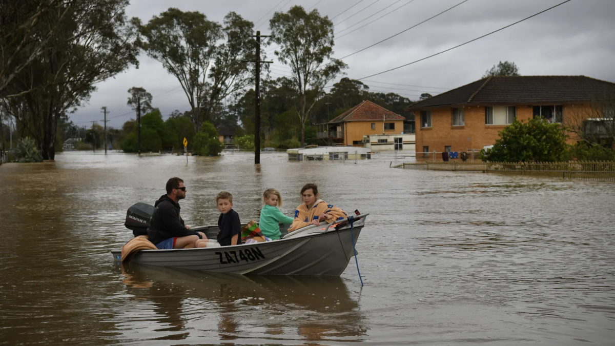 The Turner family children were rescued from the second story of their Shanes Park home in north-west Sydney on 5 July 2022, after the fourth flood in less than 18 months. Photo: Dean Sewell / The Sydney Morning Herald