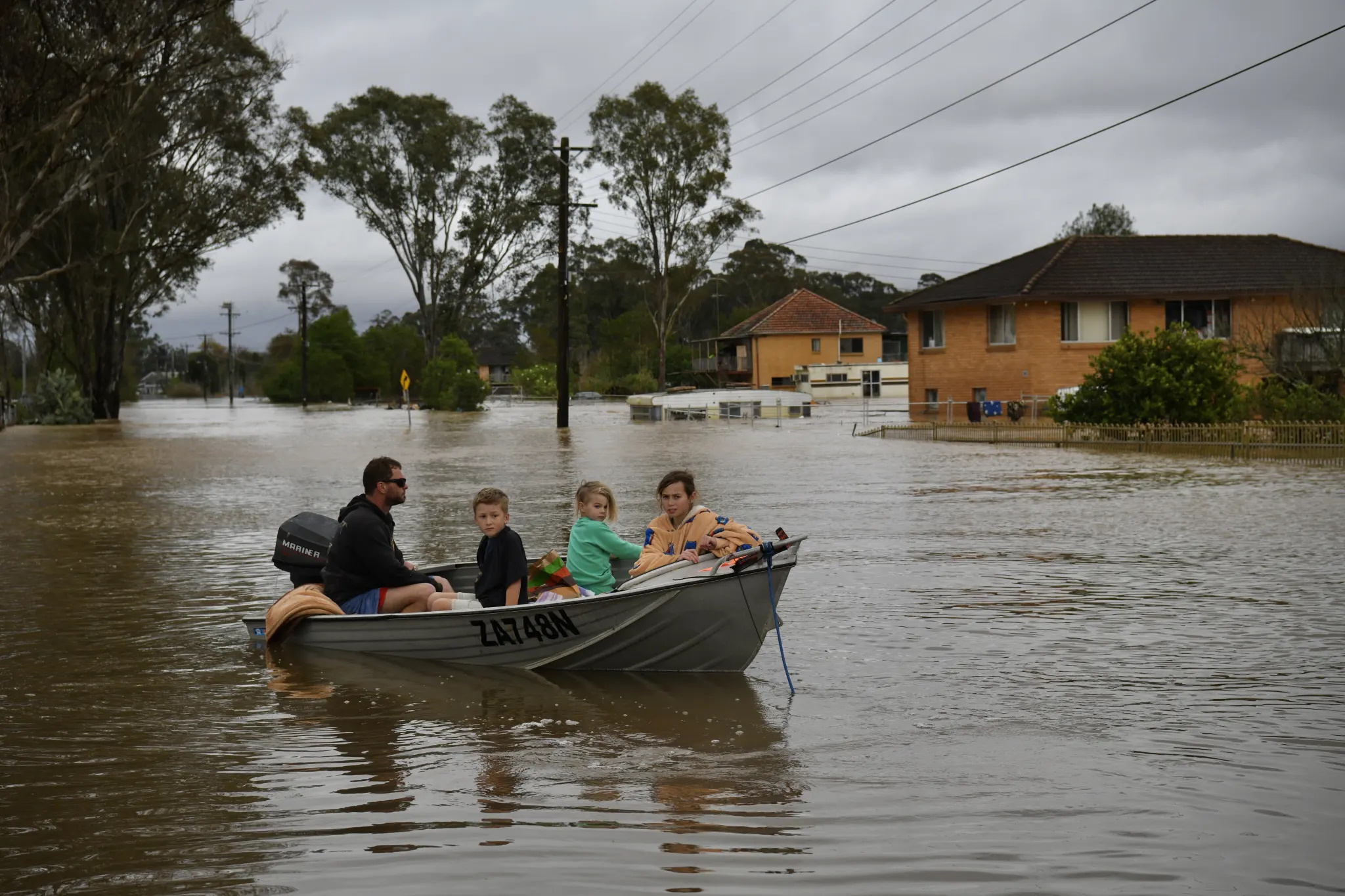 The Turner family children were rescued from the second storey of their Shanes Park home in north-west Sydney on 5 July 2022, after the fourth flood in less than 18 months. Photo: Dean Sewell / The Sydney Morning Herald
