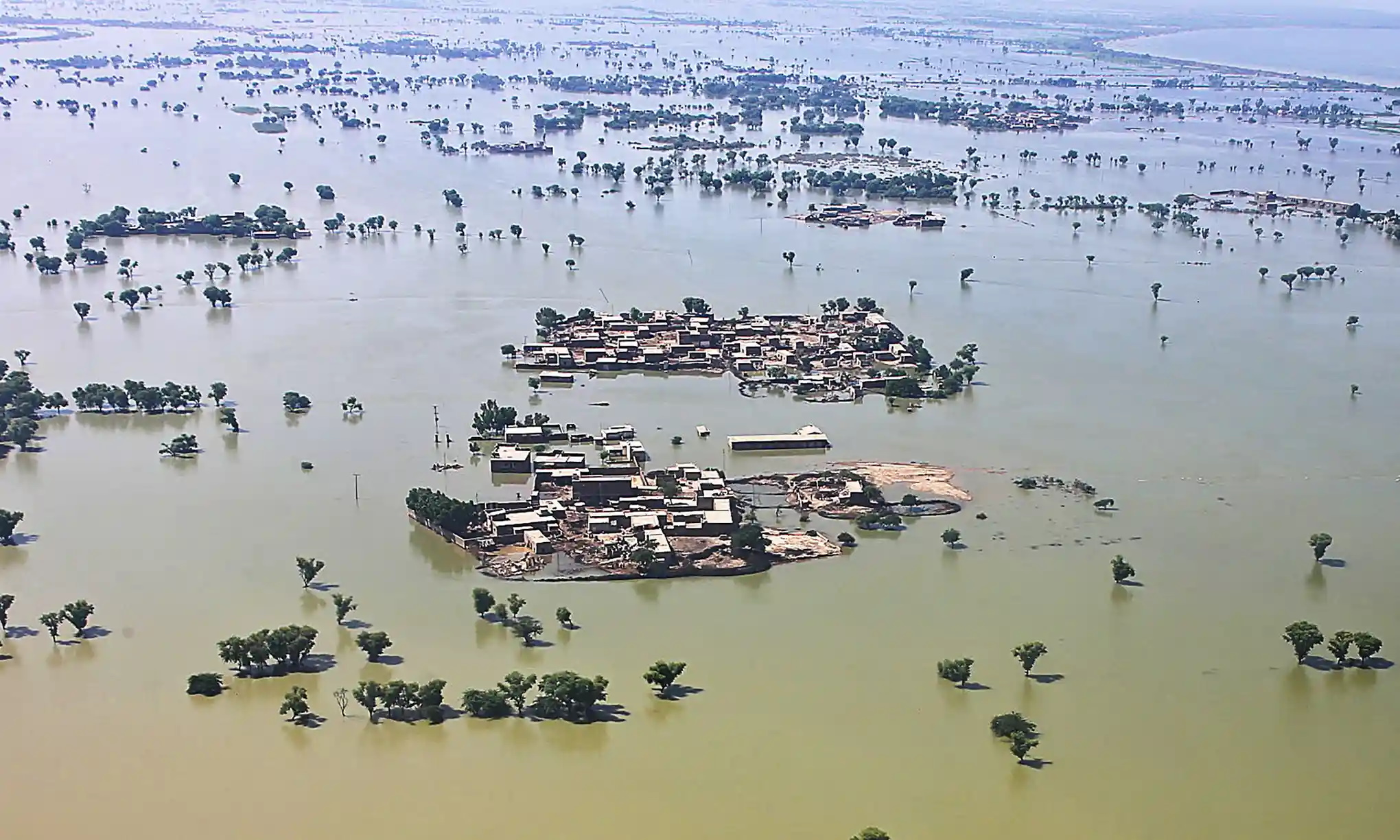 Aerial view of a flooded residential area after heavy monsoon rains in Sindh province, Pakistan, where aid workers are facing huge challenges to reach those in need. Photo: Husnain Ali / AFP / Getty Images