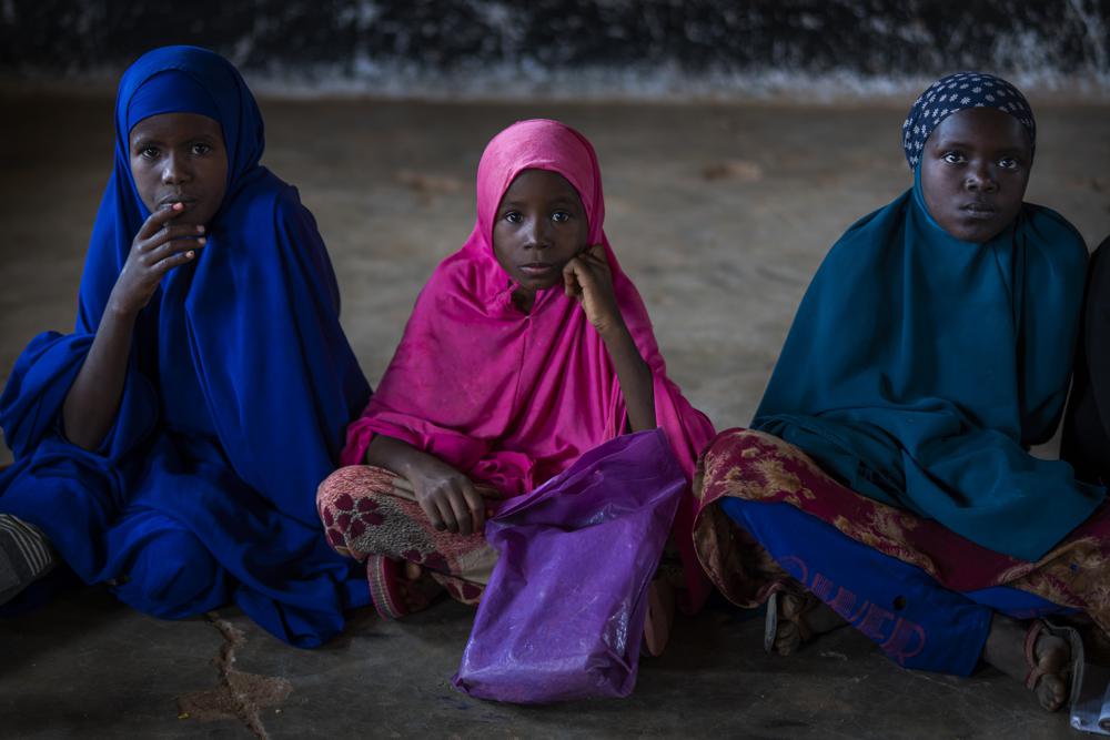 Girls attend a class at a school in Dollow, Somalia, on Monday, 19 September 2022. At midday, dozens of hungry children from the camps try to slip into a local primary school where the World Food Program offers a rare lunch program for students. Photo: Jerome Delay / AP Photo