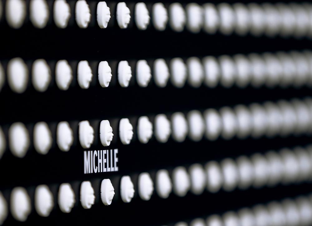 A name is under one of the 22,000 pills with faces of people who fatally overdosed carved into them in a memorial at the University of Pittsburgh, in this file photo from 29 January 2018, in Pittsburgh. Heading into key elections in 2022, there have been assertions that the drug might be handed out like Halloween candy, something the U.S. Drug Enforcement Agency's head has said isn't true. And some candidates for elected office frame the crisis as mostly a border-control issue, though experts say the key to reining in the crisis is reducing demand for the drugs. Photo: Keith Srakocic / AP Photo
