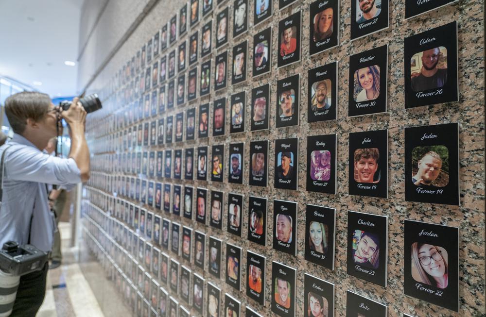 A photojournalist takes pictures of the exhibits on “The Faces of Fentanyl” at DEA headquarters before a press event at DEA headquarters, Arlington, Va., in this file photo from 27 September 2022. Heading into key elections, there have been assertions that the drug might be handed out like Halloween candy, something the U.S. Drug Enforcement Agency's head has said isn't true. And some candidates for elected office frame the crisis as mostly a border-control issue, though experts say the key to reining in the crisis is reducing demand for the drugs. Photo: Gemunu Amarasinghe / AP Photo