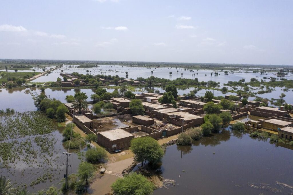 An aerial view of a flooded residential area in Sindh Province, southeastern Pakistan, after devastating monsoon rains in August 2022. Photo: Zaidi / UNICEF