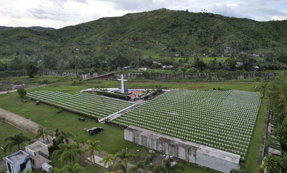 Rows of crosses sit at the mass grave site at the Holy Cross Memorial Garden for victims of super Typhoon Haiyan in Tacloban, central Philippines on Sunday, 23 October 2022. About 40 percent of the population of Tacloban was relocated to safer areas after super Typhoon Haiyan wiped out most of the villages, killing thousands when it hit central Philippines in 2013. Photo: Aaron Favila / AP Photo