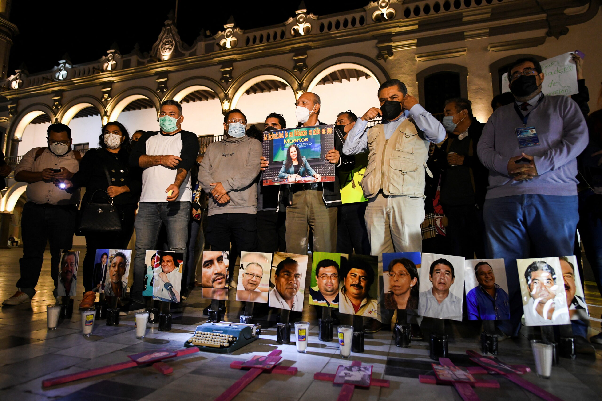 Mexican journalists gather around pictures of murdered colleagues as they protest the recent killings of photojournalist Margarito Martinez and journalist Lourdes Maldonado, in Veracruz, Mexico, on 25 January 2022. Photo: Yahir Ceballos / Reuters
