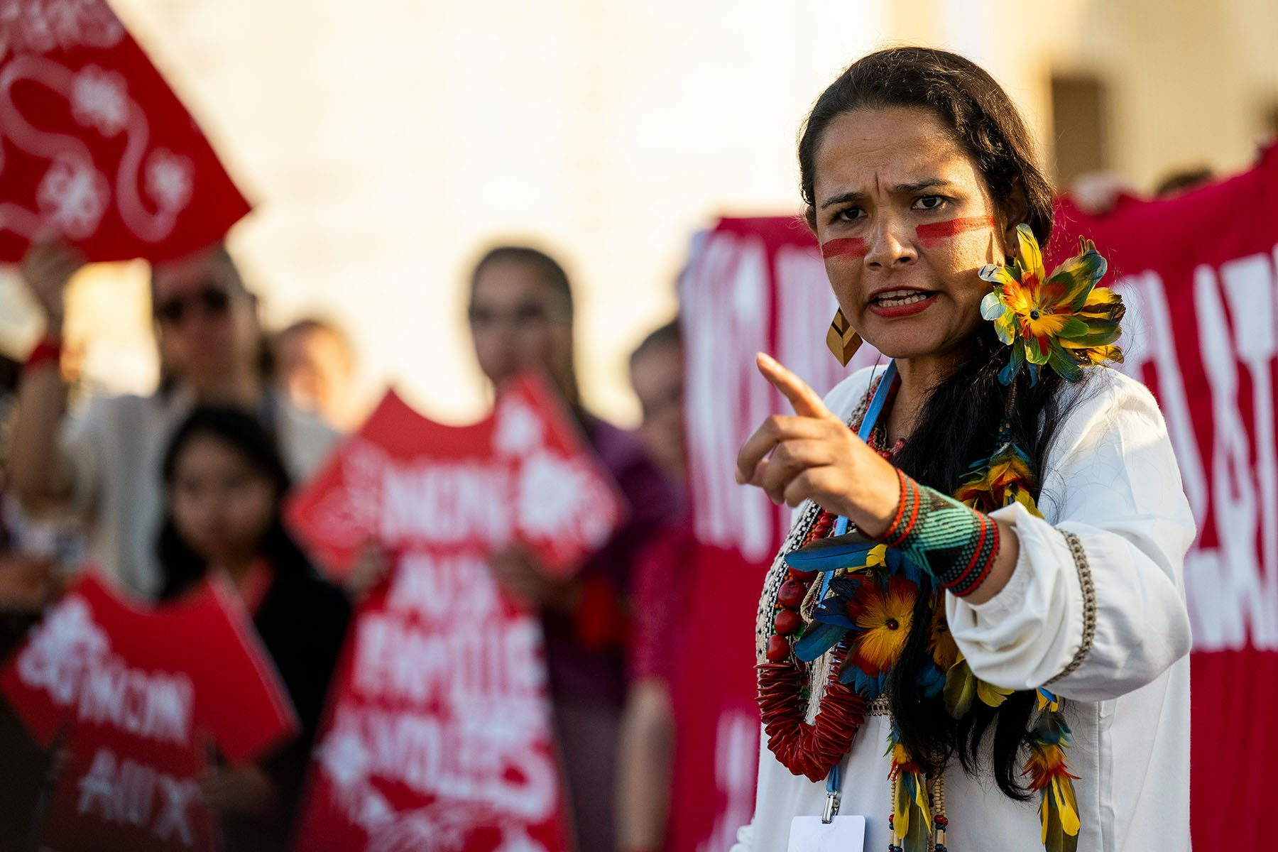 An Indigenous woman speaks during a demonstration calling attention to stolen land at the COP27 U.N. Climate Summit in Sharm el-Sheikh, Egypt. Photo: Christophe Gateau / Picture Alliance / Getty Images